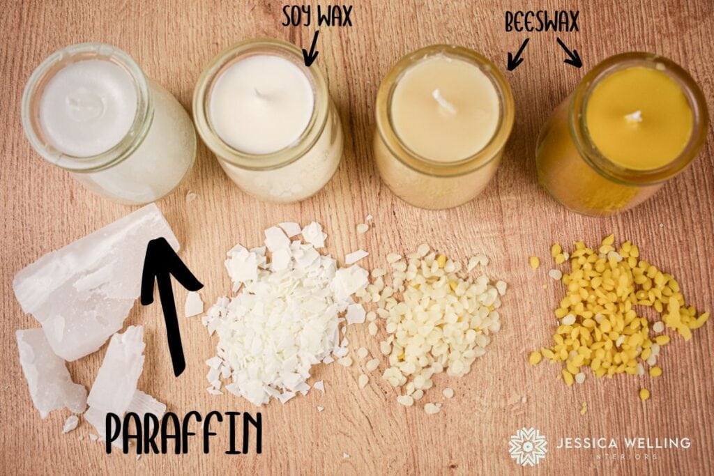 4 candles lined up next to the kinds of wax used to make each one- paraffin, soy, and beeswax