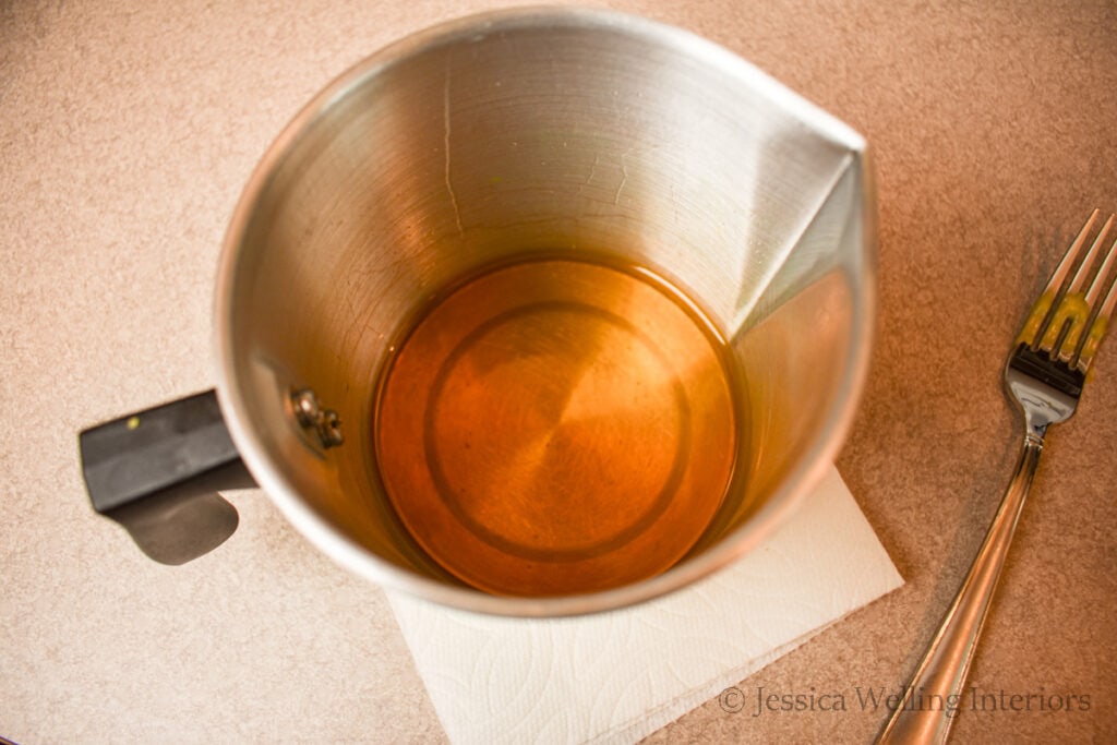 pitcher of melted beeswax