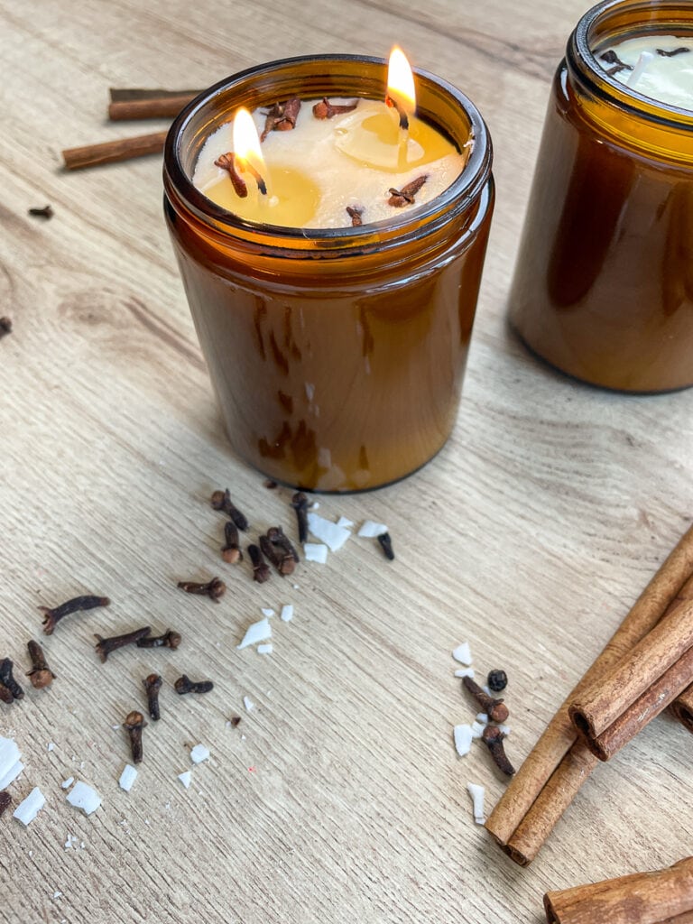burning soy candle with cinnamon and cloves