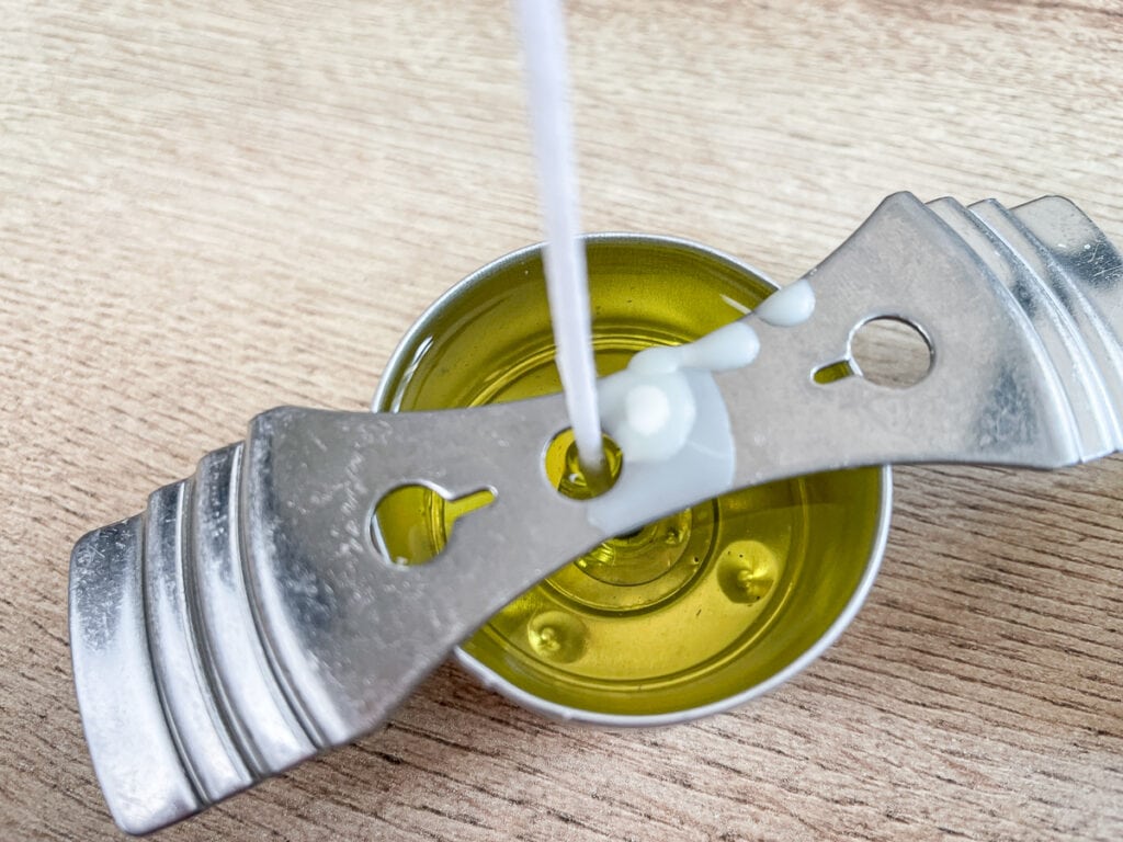 overhead view of a tealight candle being made with the was still liquid