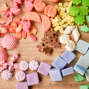 DIY wax melts on a table top in many different shapes and colors