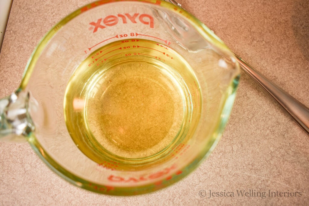 melted soy wax in a glass measuring cup