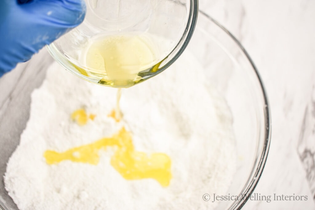 wet ingredients being poured into dry ingredients