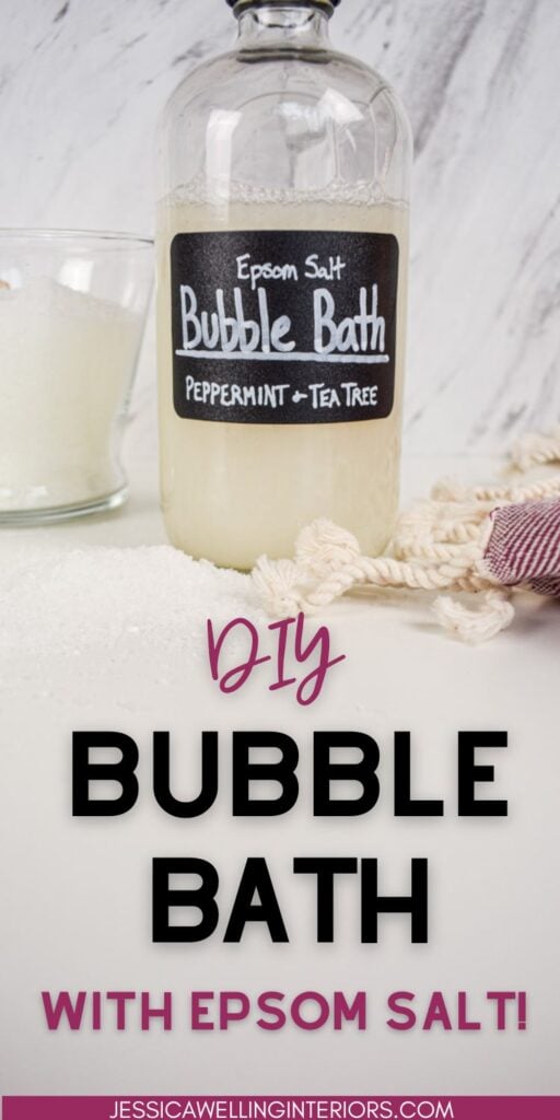 DIY Bubble Bath with Epsom Salt bottle of homemade bubble bath on a bathroom counter with a jar f epsom salt and a towel
