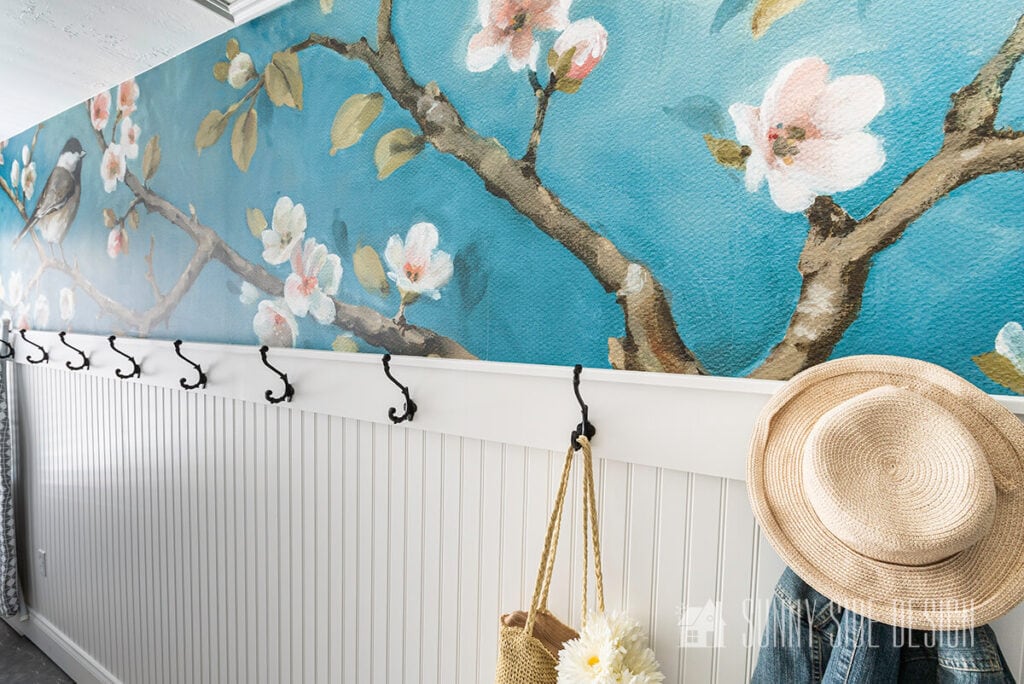 entryway with colorful floral wallpaper