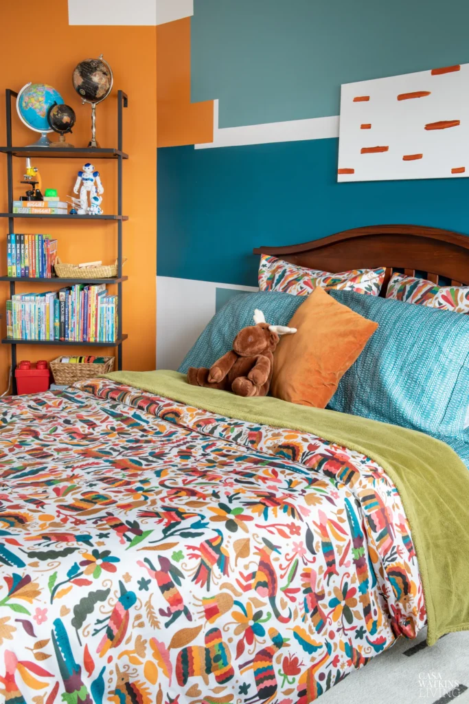 colorful child's bedroom with a color block-painted accent wall