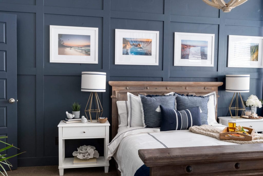 master bedroom with a bold navy blue board and batten accent wall