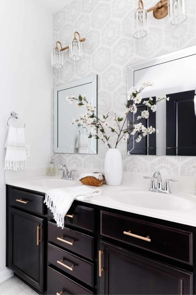 bathroom vanity with a hand stenciled geometric accent wall