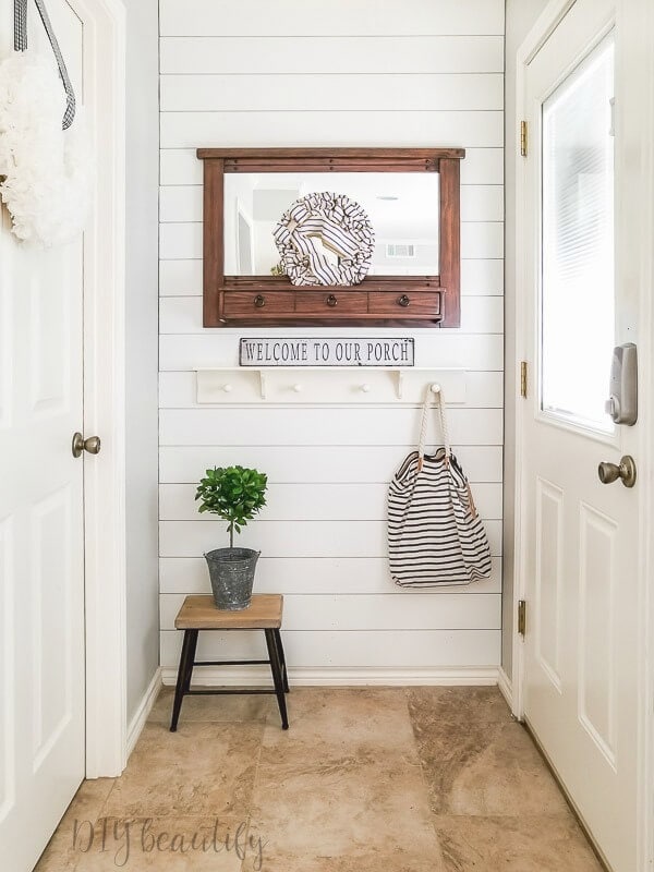 small entryway with a DIY shiplap accent wall