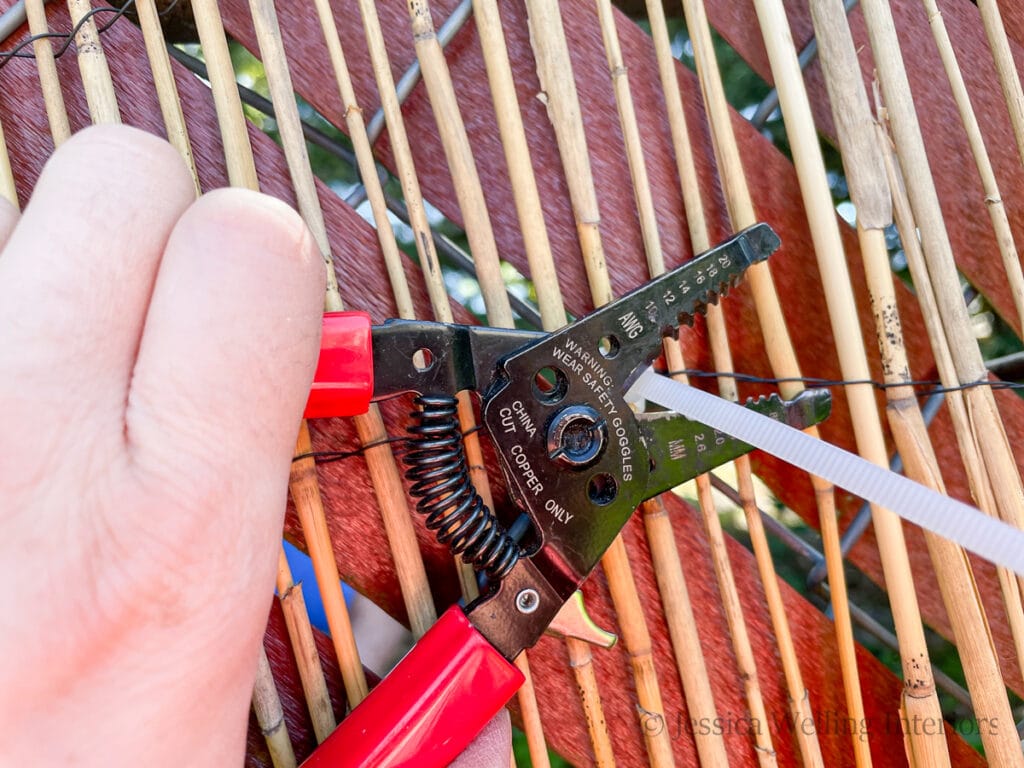close-up of a cable tie being cut with wire cutters