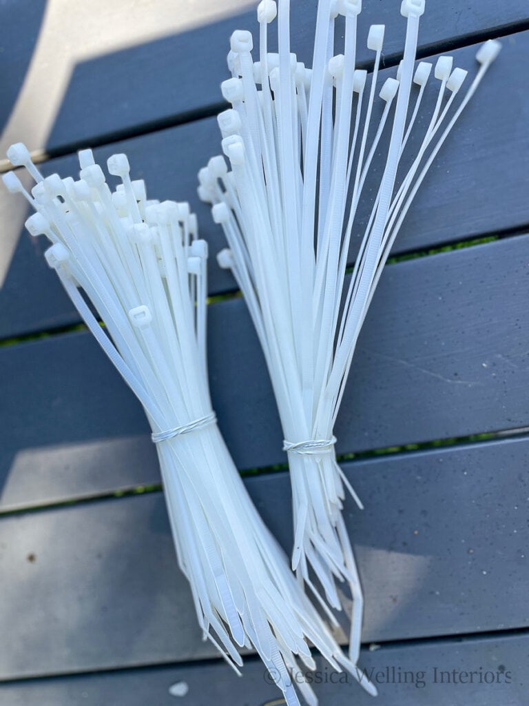 two bundles of white cable ties