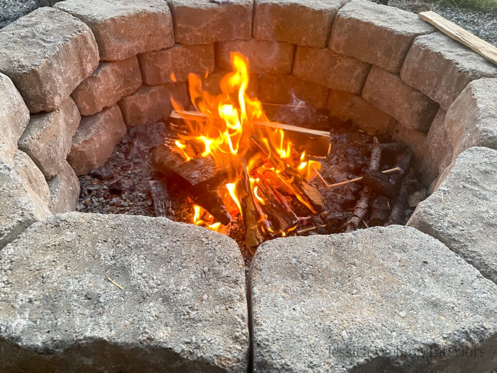 overhead view of a DIY fire pit with a fire burning in it