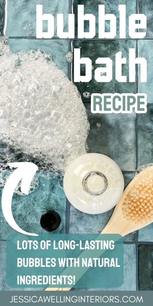 bubble bath recipe: lots of long-lasting bubbles with natural ingredients overhead view of a bottle of homemade bubble bath and bubbles on a tile countertop