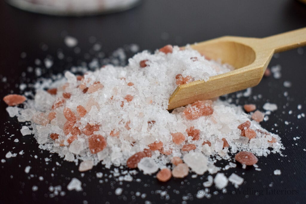 close-up of Himalayan bath salt with a wood scoop