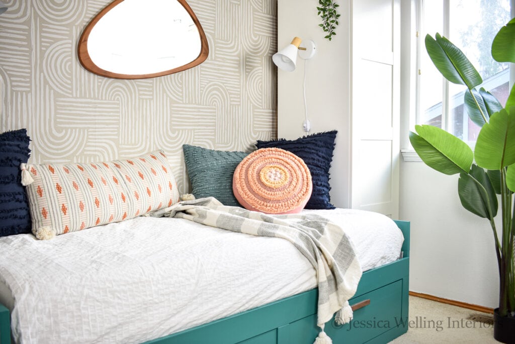 modern Boho bedroom with a daybed and geometric wallpaper