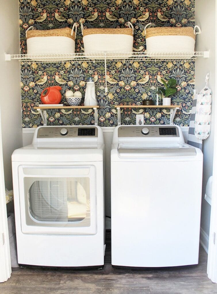 cute laundry closet with top load washing machine