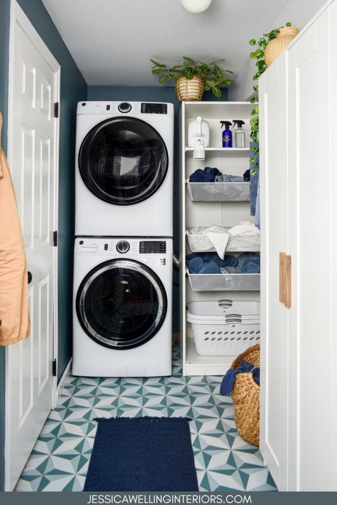 small laundry room with a stacked washer and dryer