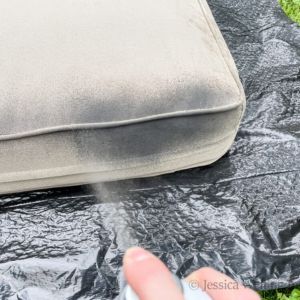 outdoor cushion being painted with spray paint